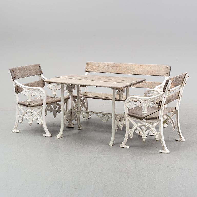 A group of furniture, table, sofa and two armchairs, early 20th century.