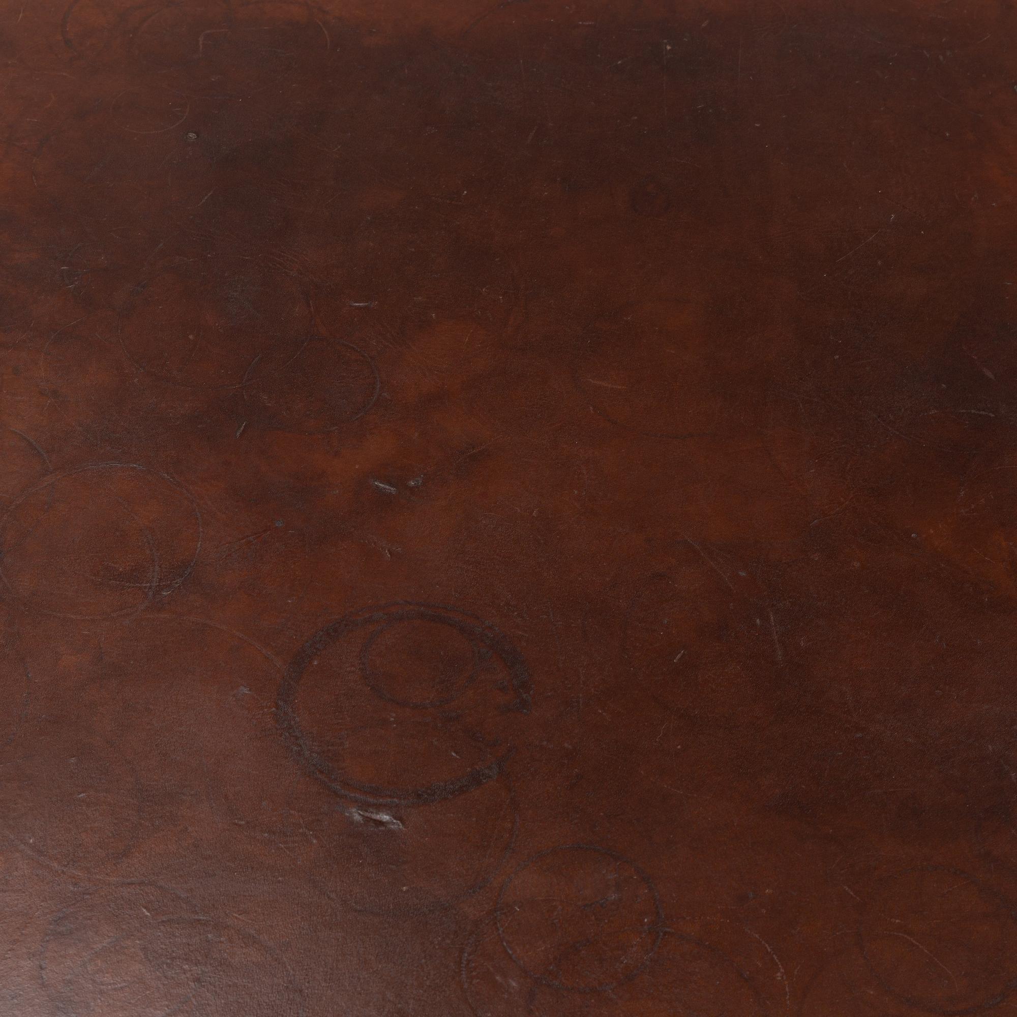 An oak and leather coffee table, mid 20th Century.