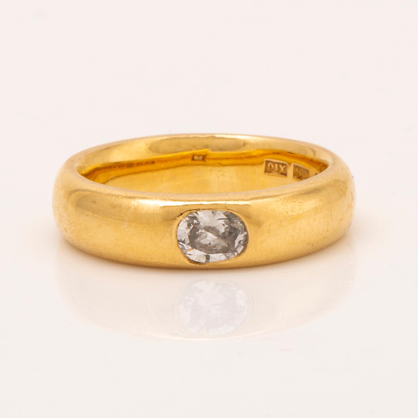 J Butler Malmö 1996 , ring 18K guld med en oval-slipad briljant ca 0,40 ct.