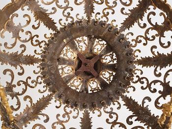 A rococo-revival gilt-brass sixteen-light chandelier, mid 19th century.