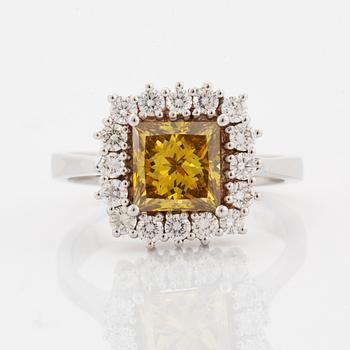 Princess-cut colour treated fancy deep brown-yellow diamond ring.
