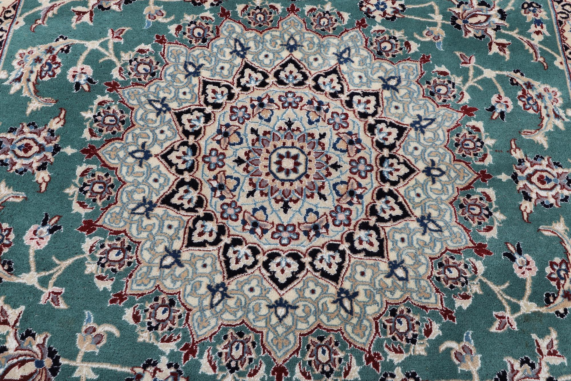 A Nain carpet, part silk, 6 laa, ca. 300 x 201 cm.