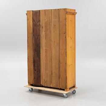 A pinewood cabinet, later part of the 19th Century.
