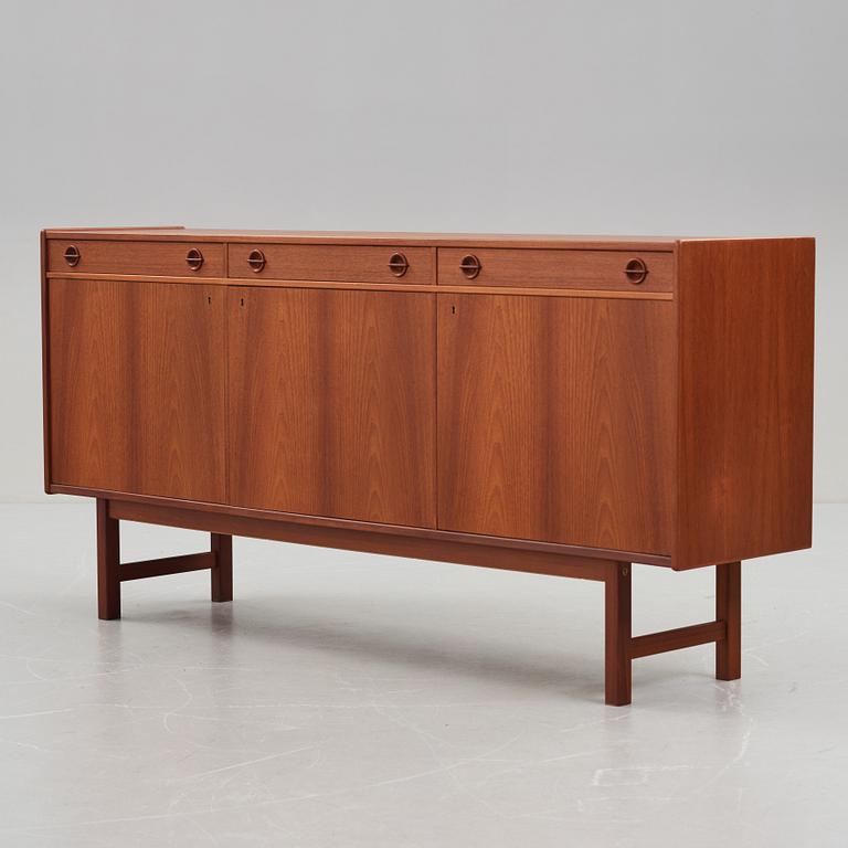 A late 20th Century teak veneered sideboard.