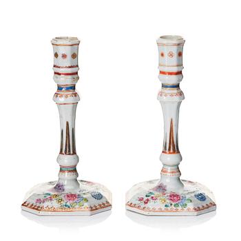 1054. A pair of famille rose candles sticks, Qing dynasty, Qianlong (1736-95).