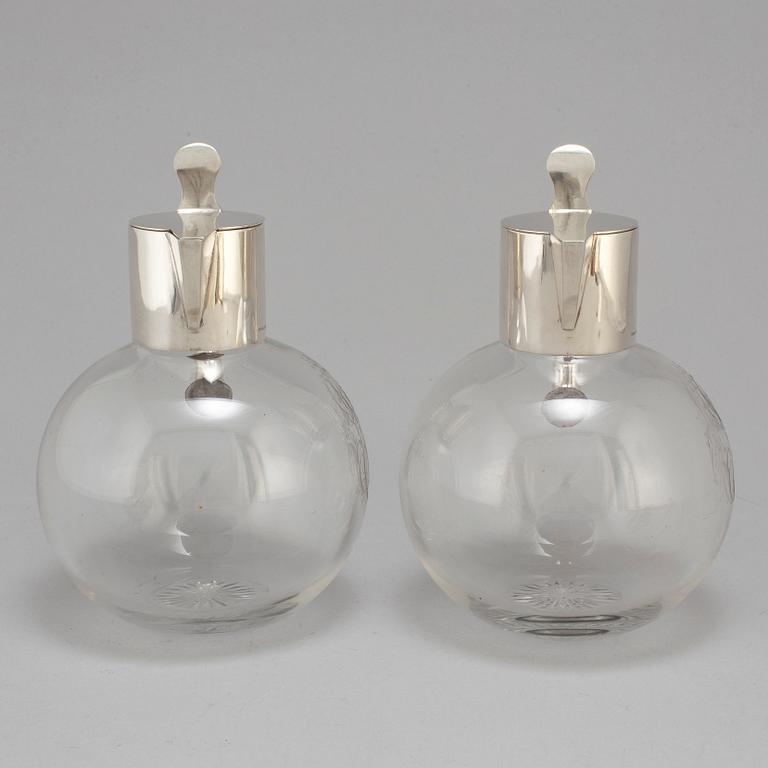 A pair of caraffes with silver mountings by CG Hallberg, Stockholm 1890.