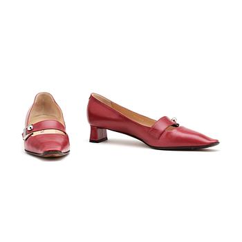 834. LOUIS VUITTON, a pair of red leather shoes.