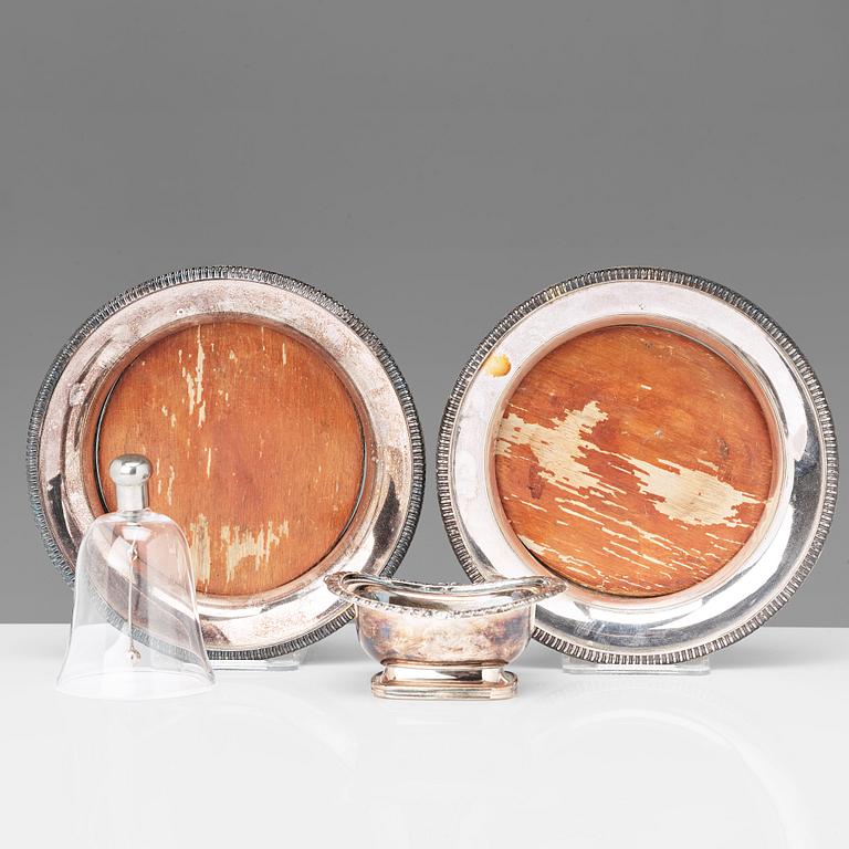 A pair of 20th century coasters, white metal and an English silver plated salt-cellar and A 20th c glass table-bell.