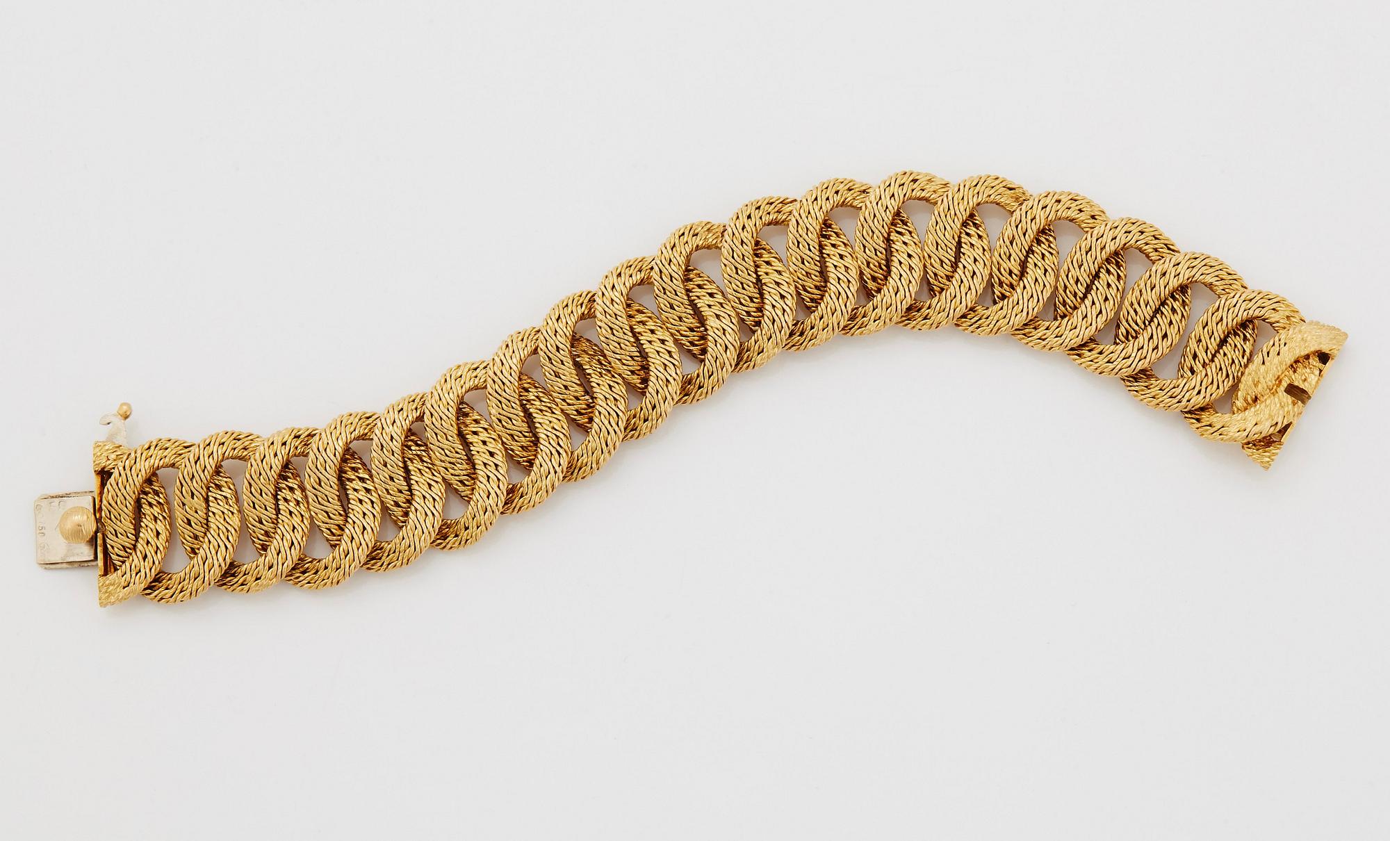 Georges L'Enfant an 18K gold demi parure comprising a necklace, a bracelet and a ring.