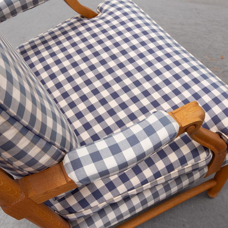 An end of the 20th Century pair of Gustavian style oak armchairs.