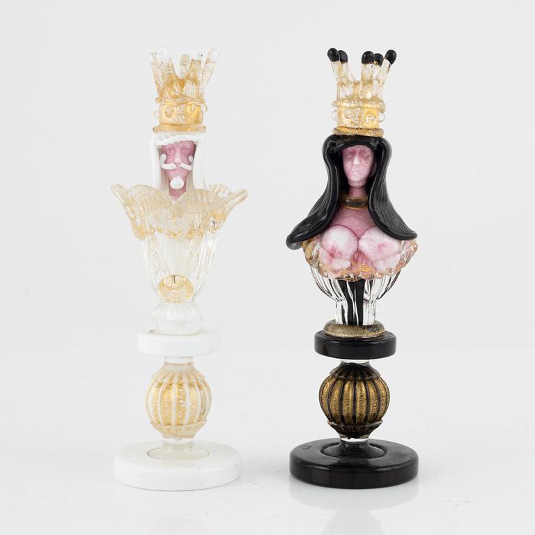 Two glass chess pieces, probably Murano, Italy.