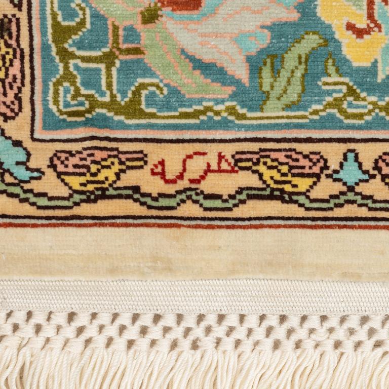 A figural silk Hereke rug, c 65 x 47 cm.