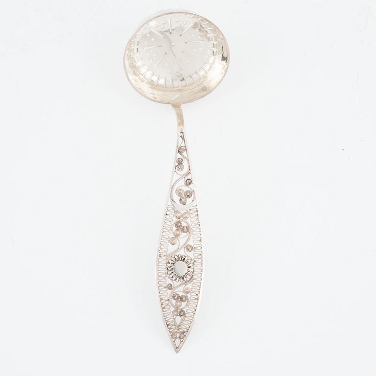 Gustaf Folcker, a silver sugar spoon with filigree, Stockholm 1814.