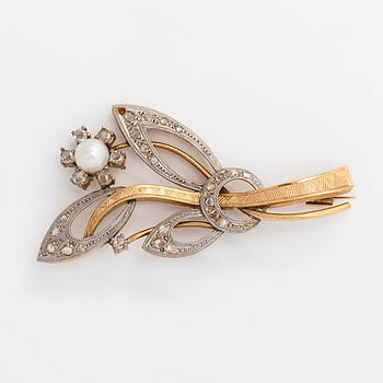 A 14K gold brooch with rose-cut diamonds and a cultured pearl.
