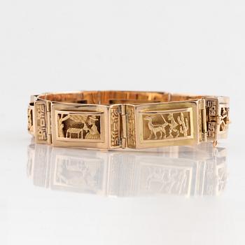 Armband, guld, paneler med figurmotiv.