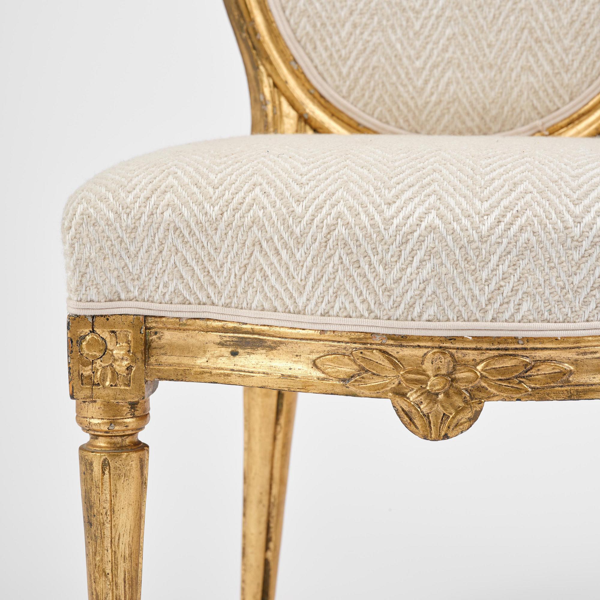 A pair of Gustavian giltwood chairs, Stockholm, late 18th century.