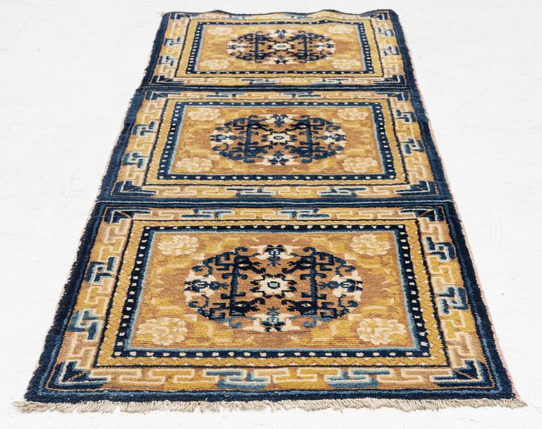 An antique Ningxia meditation rug, north west China, c 189 x 63 cm.