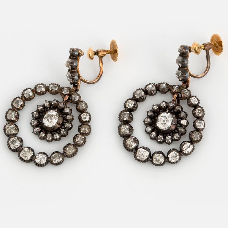 A pair of earrings set with old-cut diamonds with a total weight of ca 2.80 cts.