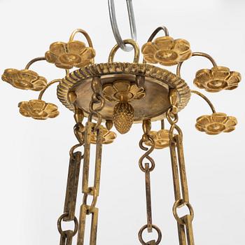 A French Empire ormolu and patinated bronze four-branch chandelier, early 19th century.