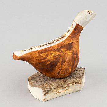 Lars Levi Sunna, a grouse reindeer horn and birch figurine, signed LL Sunna.