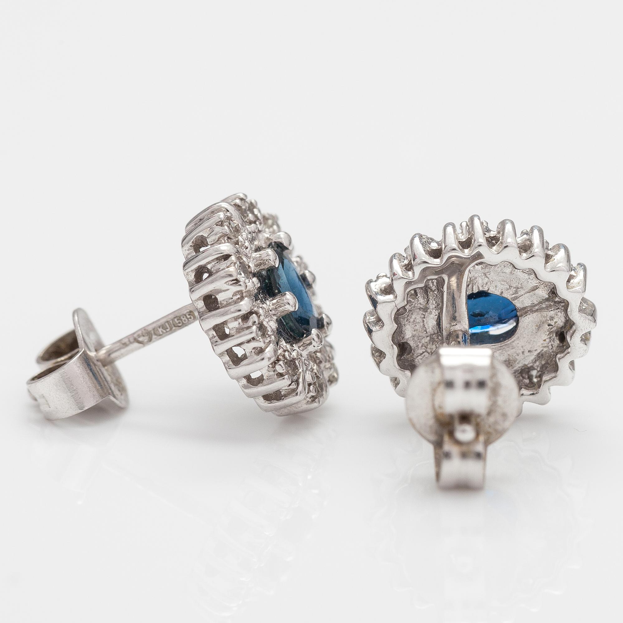A pair of 14K white gold earrings with sapphires and diamonds ca 0.05 ct in total.
