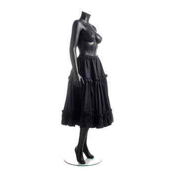 YVES SAINT LAURENT, a black silk skirt.
