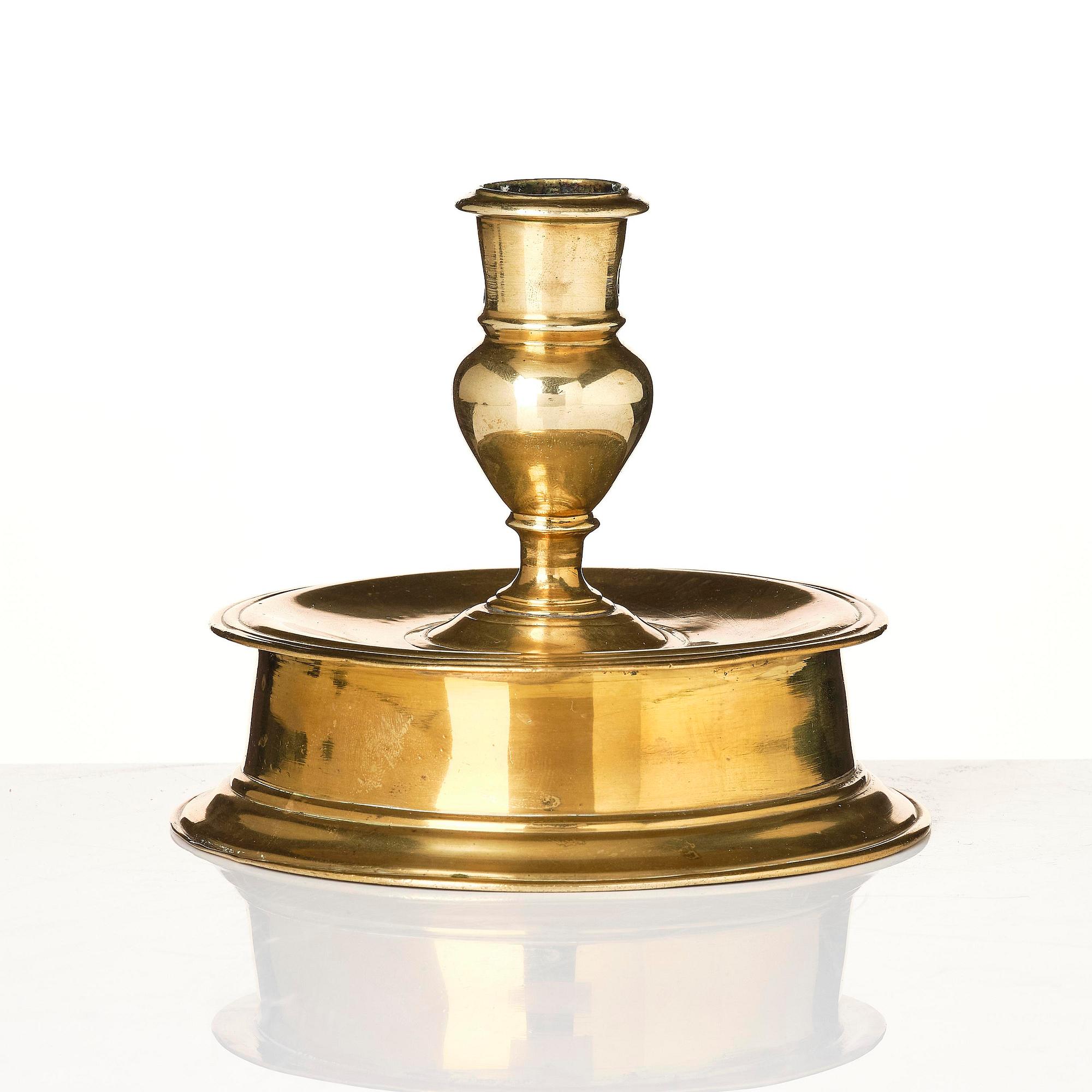 A Northern European baroque brass candlesticsk, late 17th century.