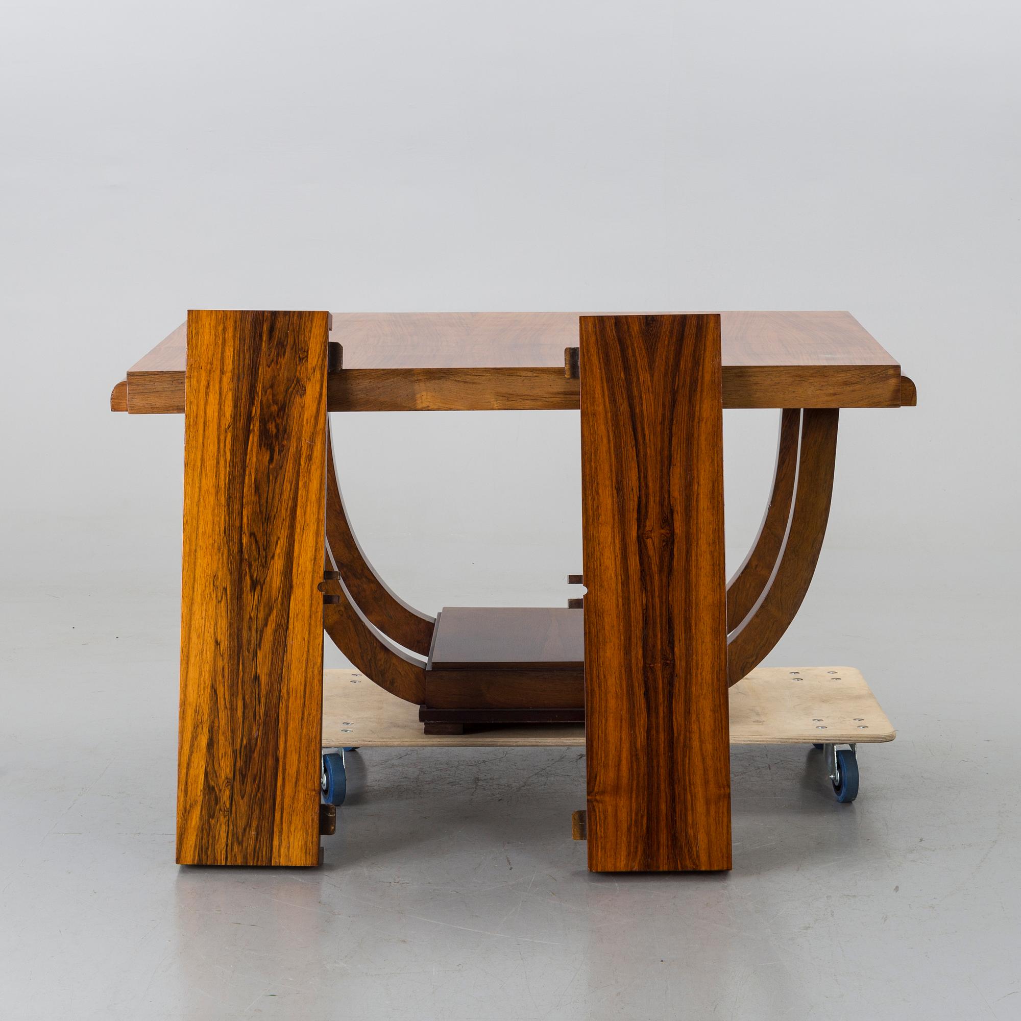 A french art deco dining table with extra boards.