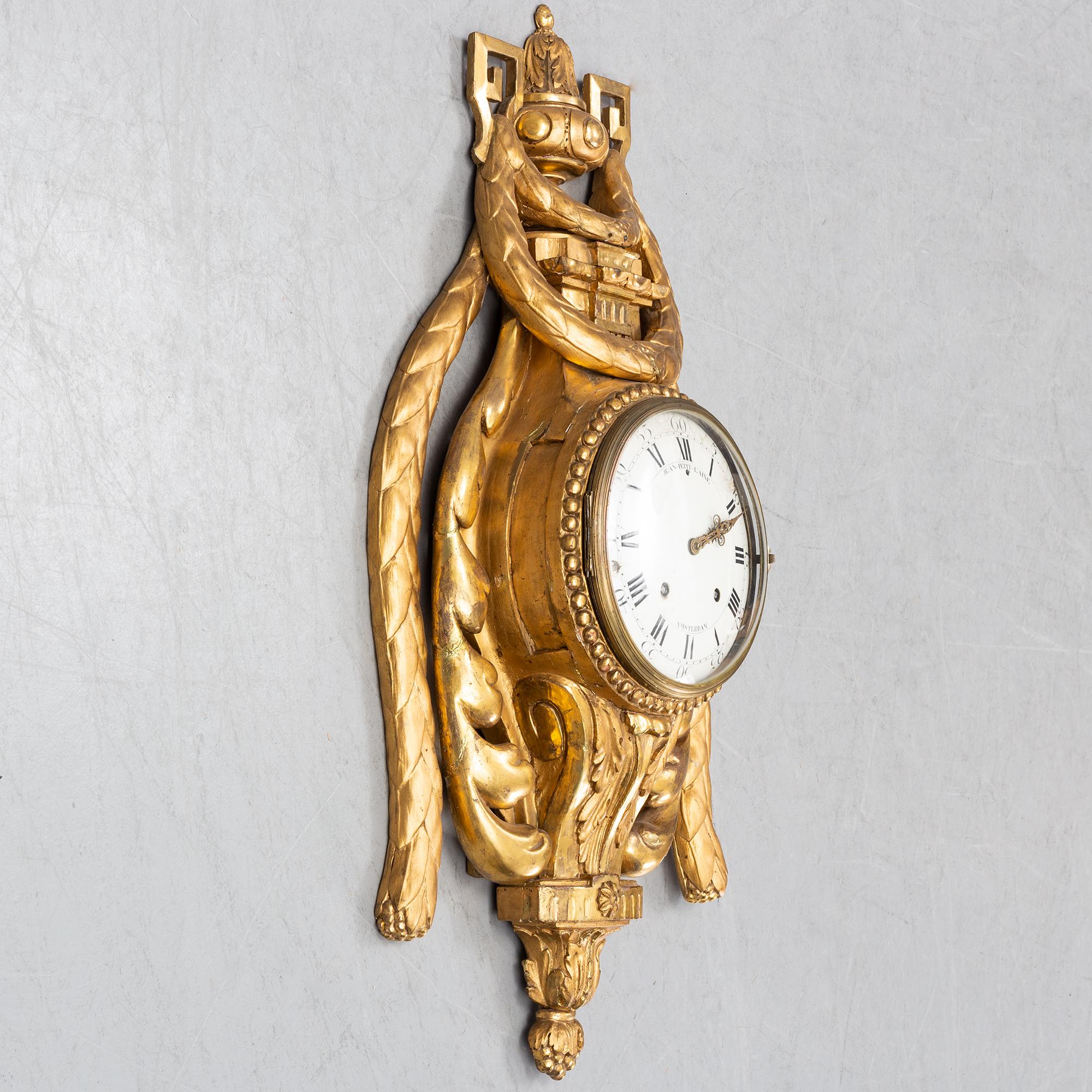 An 18th century Louis XV wall clock Jean-Petit L´Aine, Amsterdam.