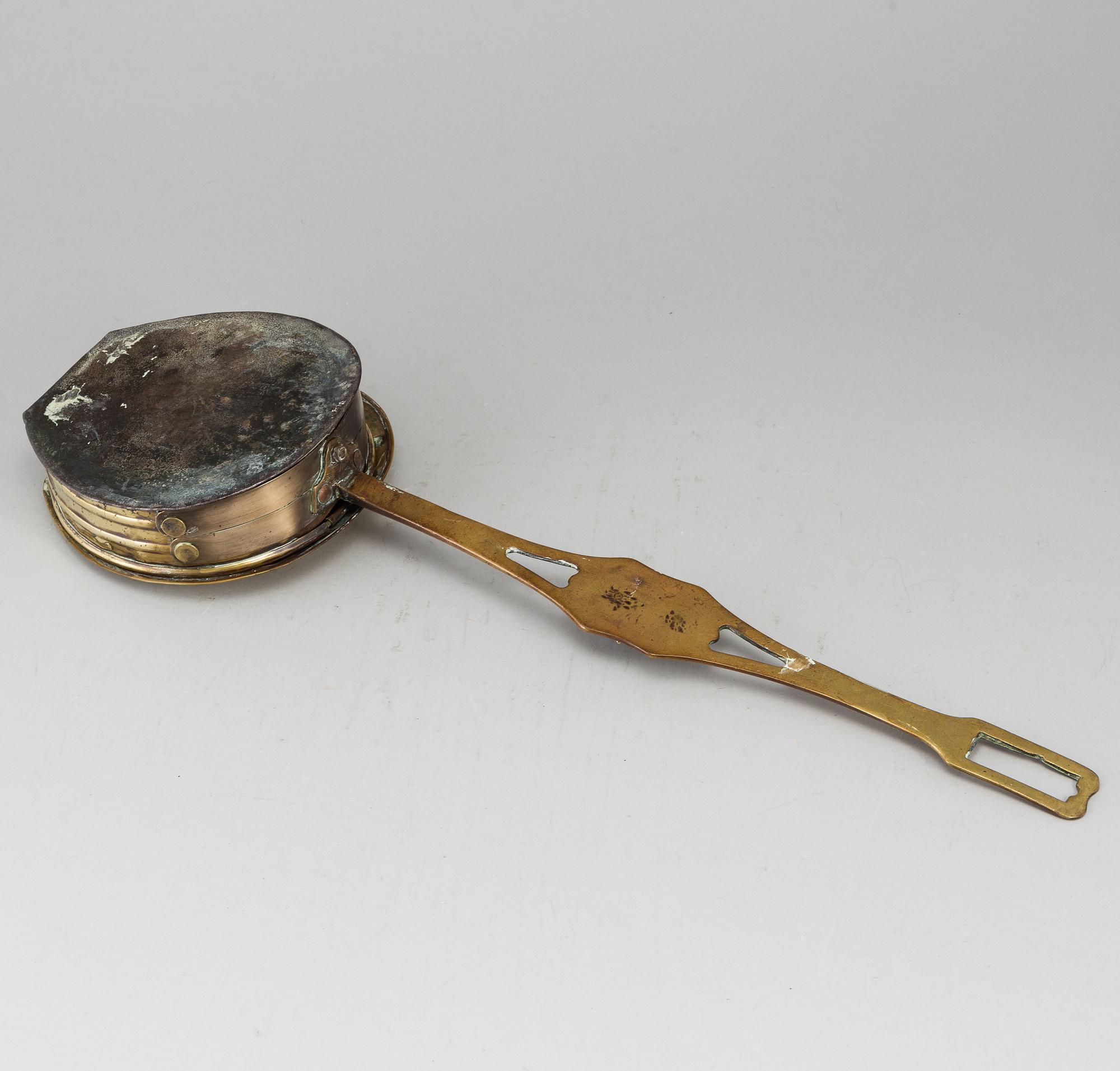 A brass chestnut roaster, 19th century.
