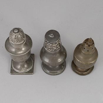 Three 18th century pewter shakers.