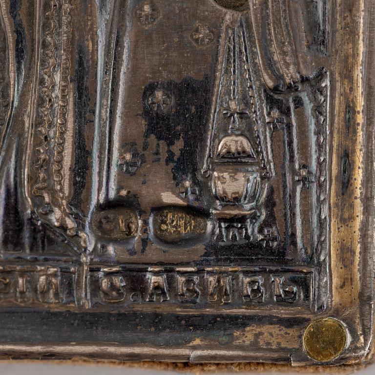 Two Russian 19th century travle icon, oklad in silver and parce-gilt, one with assayer mark AA 1890.