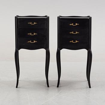 A pair of painted rococo-style bedside tables, later part of the 20th Century.