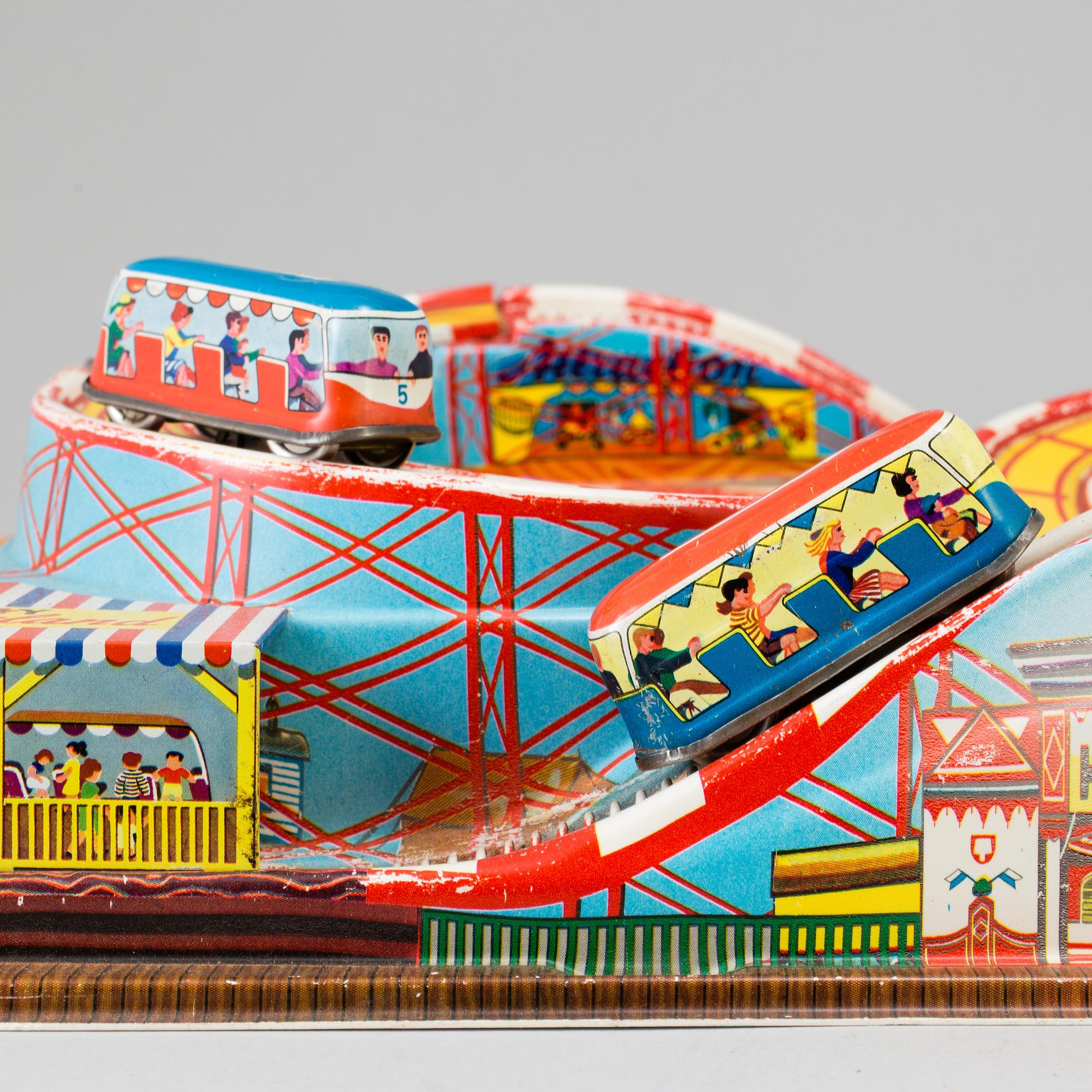 A 1960's  German toy car track with two mechanic buses.