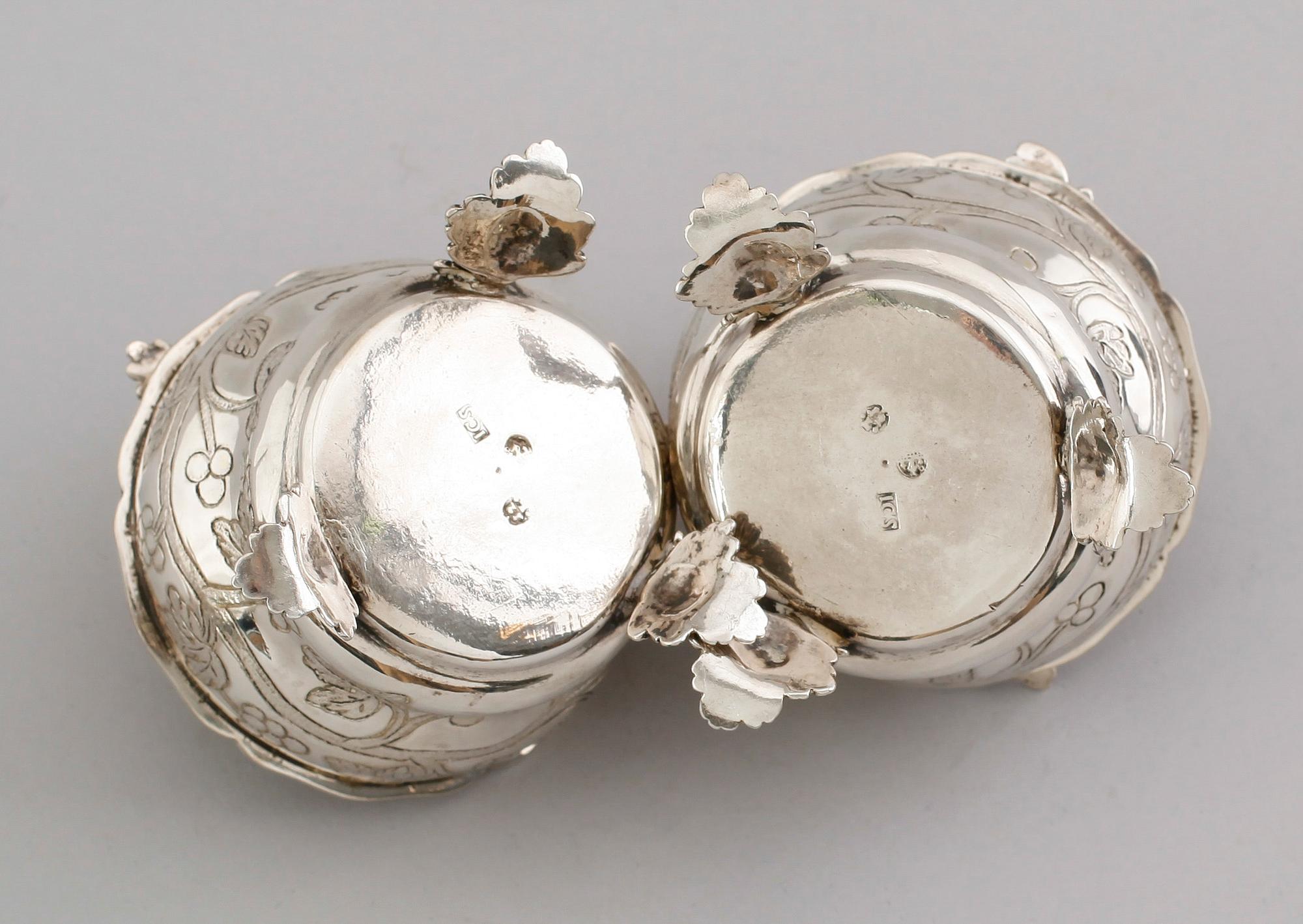 A pair of German 18th century parcel gilt jelly-pots, marks of  Johann Christoph Seelingslow, Magdeburg.