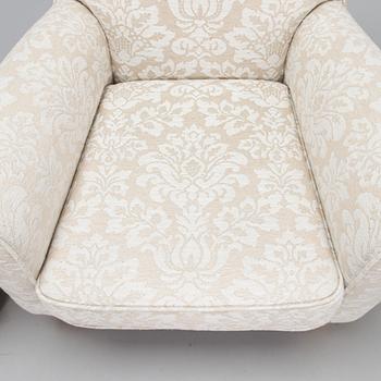 A mid-20th-century armchair and ottoman.