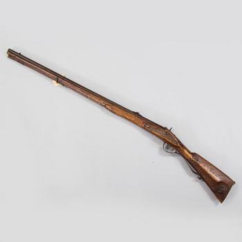 A percussion rifle marked Tula 1788.