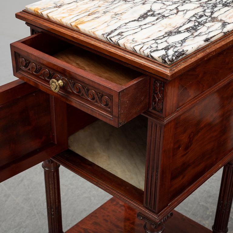 A pair of eclectic 20th century bedside tables.