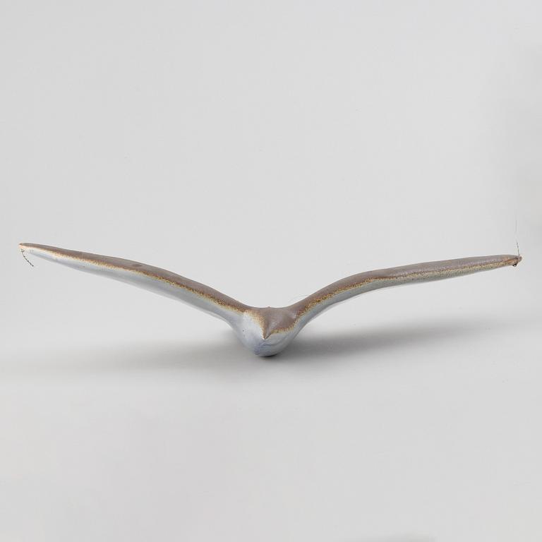 A stoneware sculpture of a sea bird, unsigned.