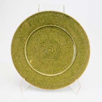 Signe Persson-Melin, a set of nine 1950s kopper glazed stoneware plates.