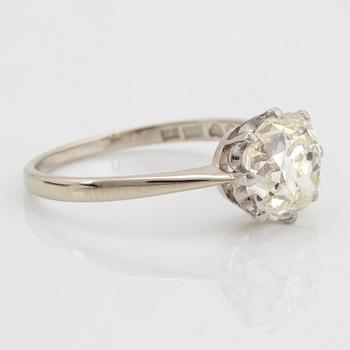 An 18K white gold ring set with a cushion formed old-cut diamond weight ca 2.75 cts quality ca L/M i.