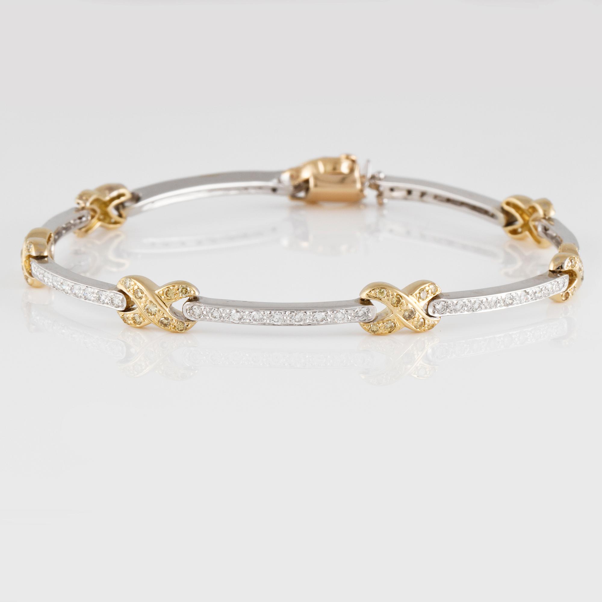ARMBAND, 14K guld och vitguld med briljantslipade vita och gula diamanter ca 1.30 ct.  Vikt 12,7 gram.