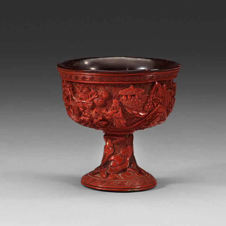 A carved cinnabar lacquer stem cup, Qing dynasty, 17th/18th Century.