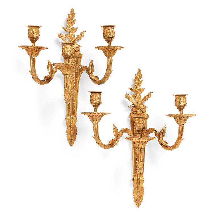 A pair of Louis XVI late 18th century gilt bronze three-light wall-lights.