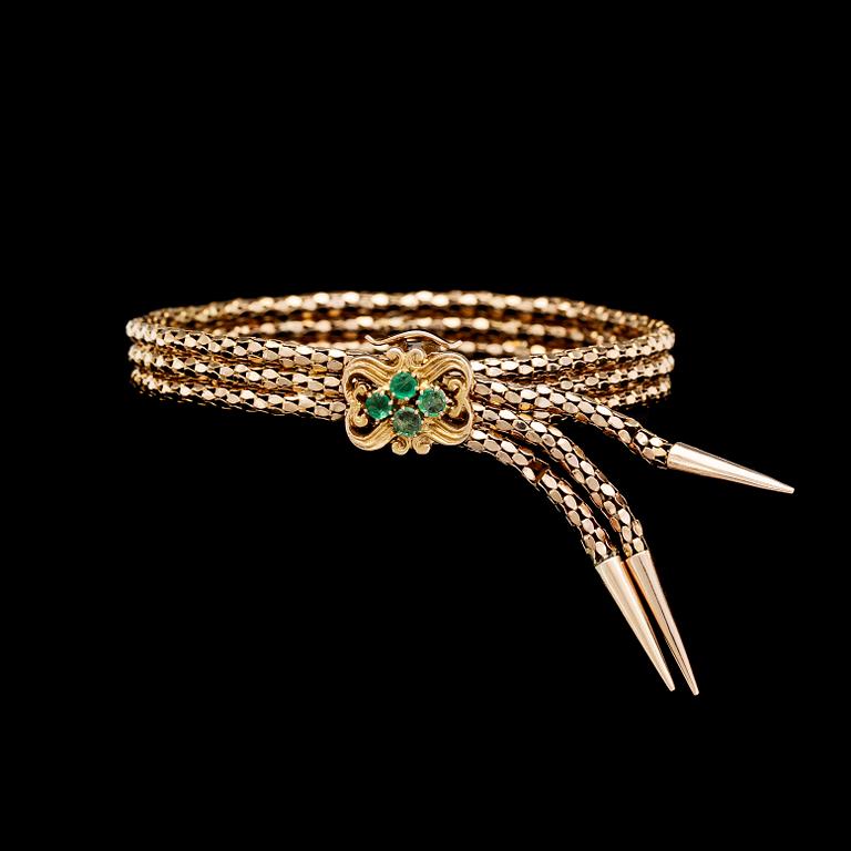 BRACELET, gold with small emeralds.