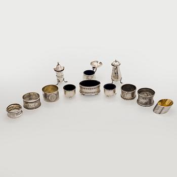 Napkin rings, 6 pcs, a pair of salt shakers, and salt cellars, silver and glass, including English and Finnish marks.