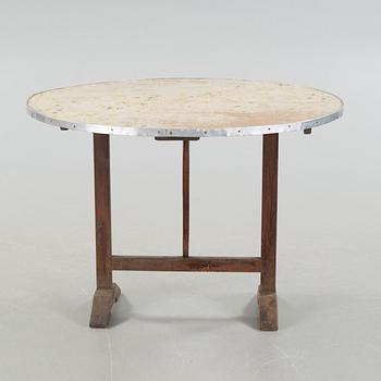 A folding table, a so called wine testing table from the early 20th century.