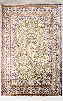 A silk rug, on cotton. 184 x 124 cm.