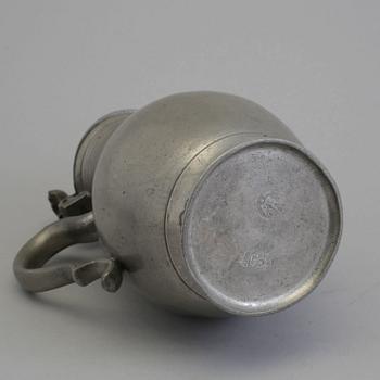 A 18th century tin pot.