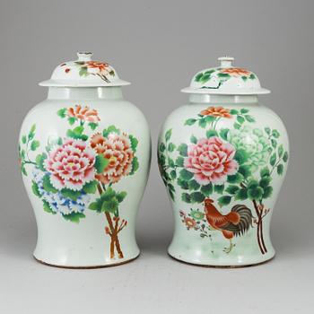 A pair of Chinese famille rose vases with covers, 20th century.